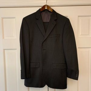 Dark charcoal suit (with narrow strips) along with matching pants.